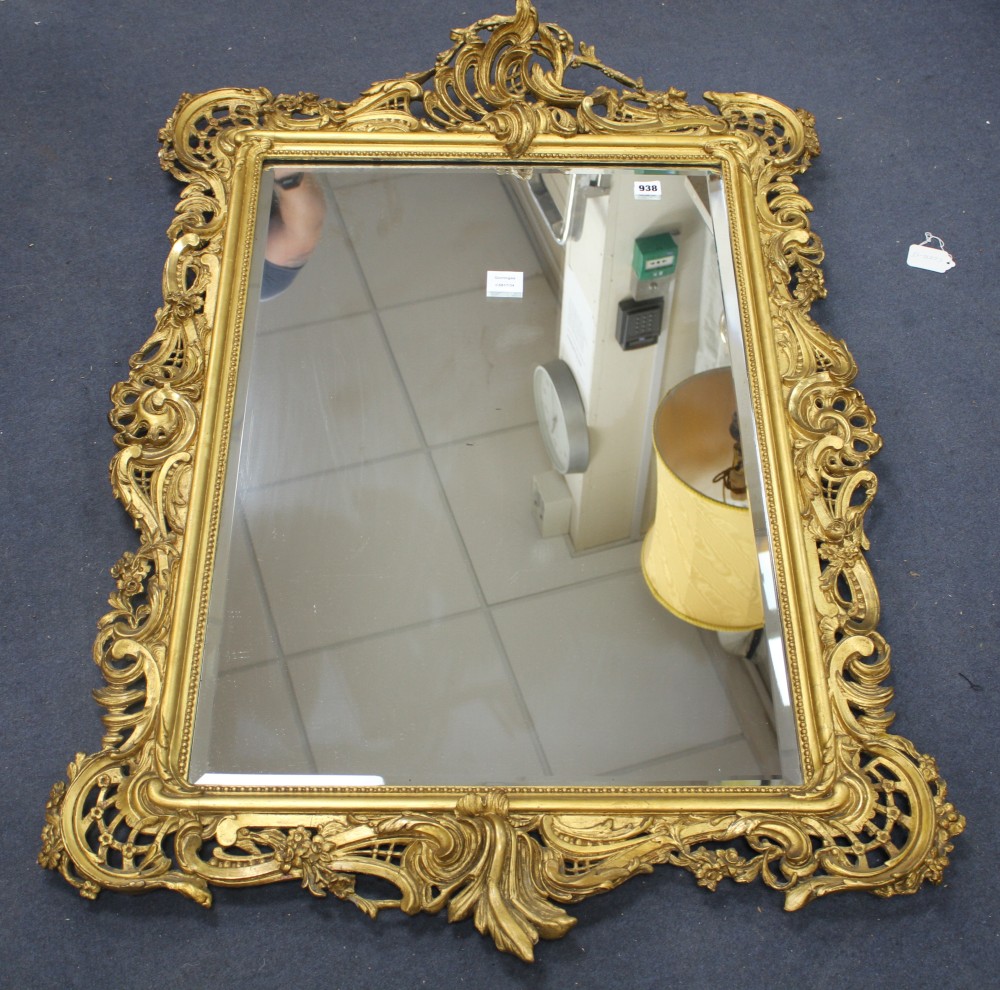 A French gilt gesso scroll frame wall mirror, with bevelled rectangular plate, W.81cm H.118cm
